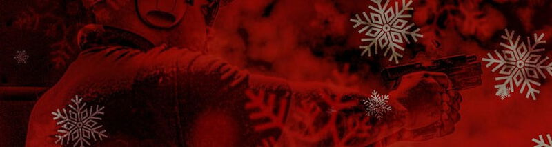 2 hunters crouching next to corn field