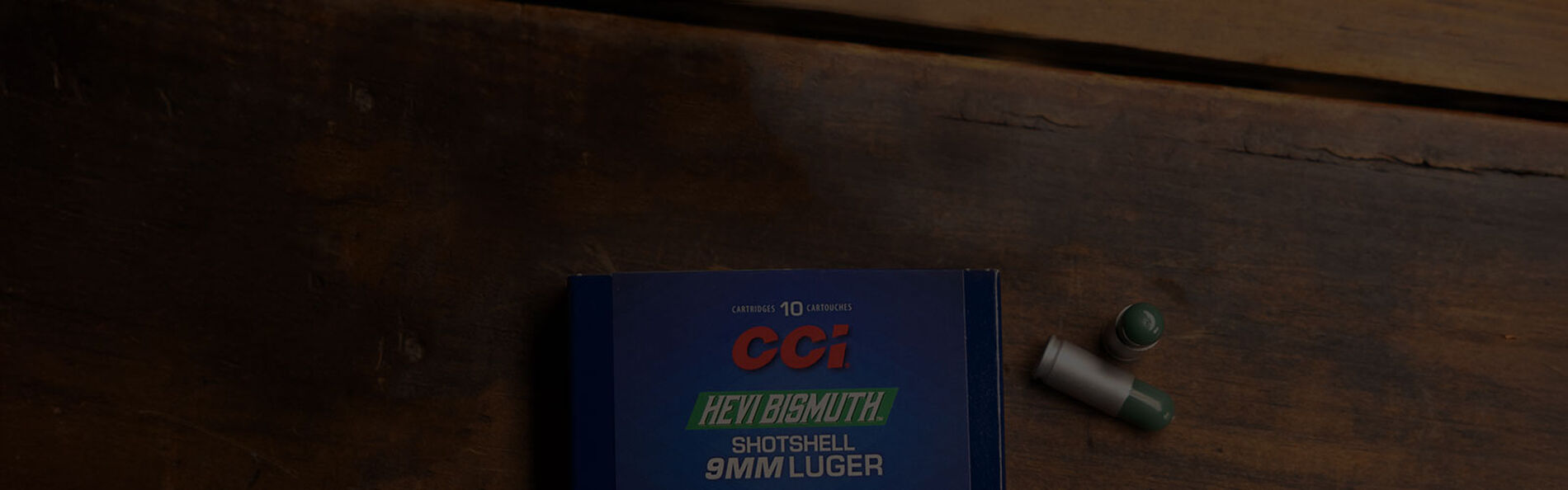 HEVI-Bismuth Shotshell box and cartridges laying on a table
