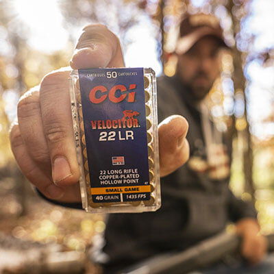 person holding CCI Velocitor 22LR box towards the camera