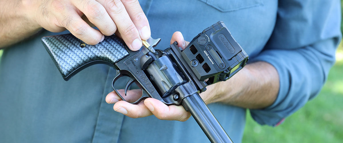 shooter loading CCI ammunition into a revolver