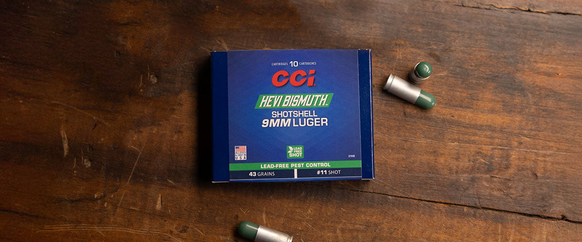 HEVI-Bismuth Shotshell box and cartridges laying on a table