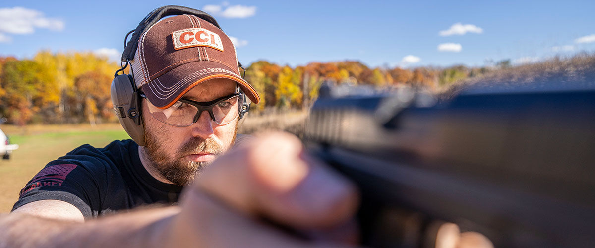 shooting rimfire handgun at an outdoor range