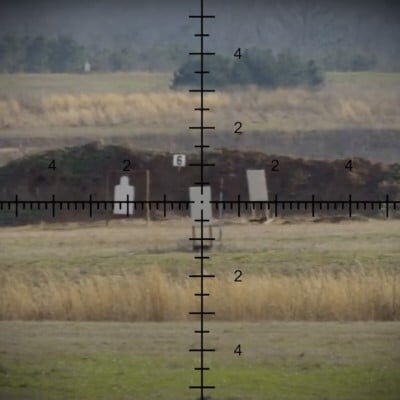 view through a rifle scope looking at long range targets