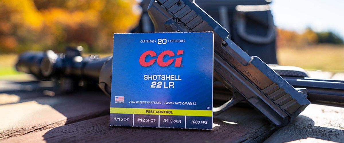 CCI Pest Control packaging sitting on a table outside in front of a handgun