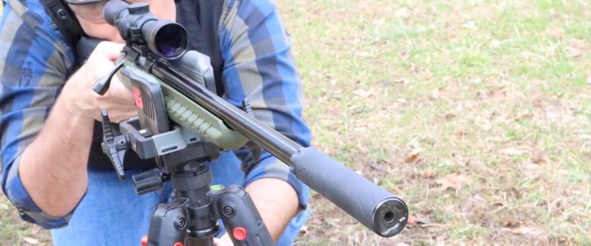 shooter looking down the scope of a rifle