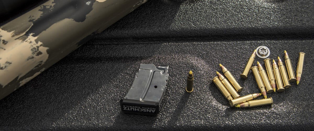 cartridges and magazine laying on a table