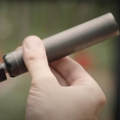 a suppressor being added to a handgun