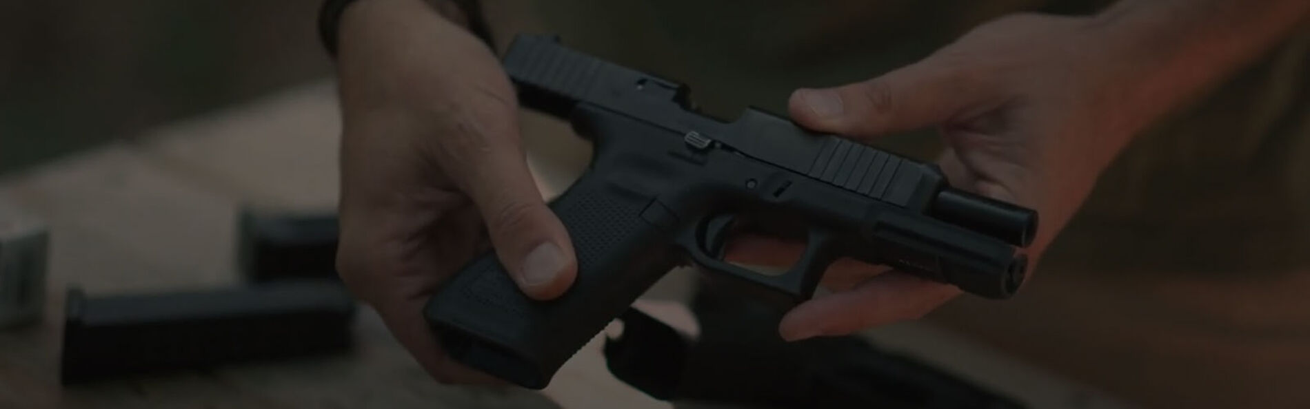 22plinkster holding rimfire handgun