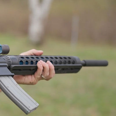 josh froelich shooting a supporessed rifle