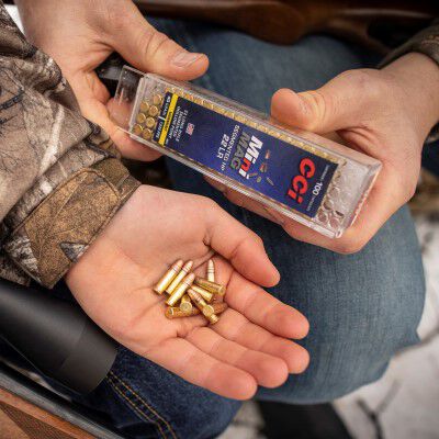 hunter holding MiniMag 22LR rounds in his hand