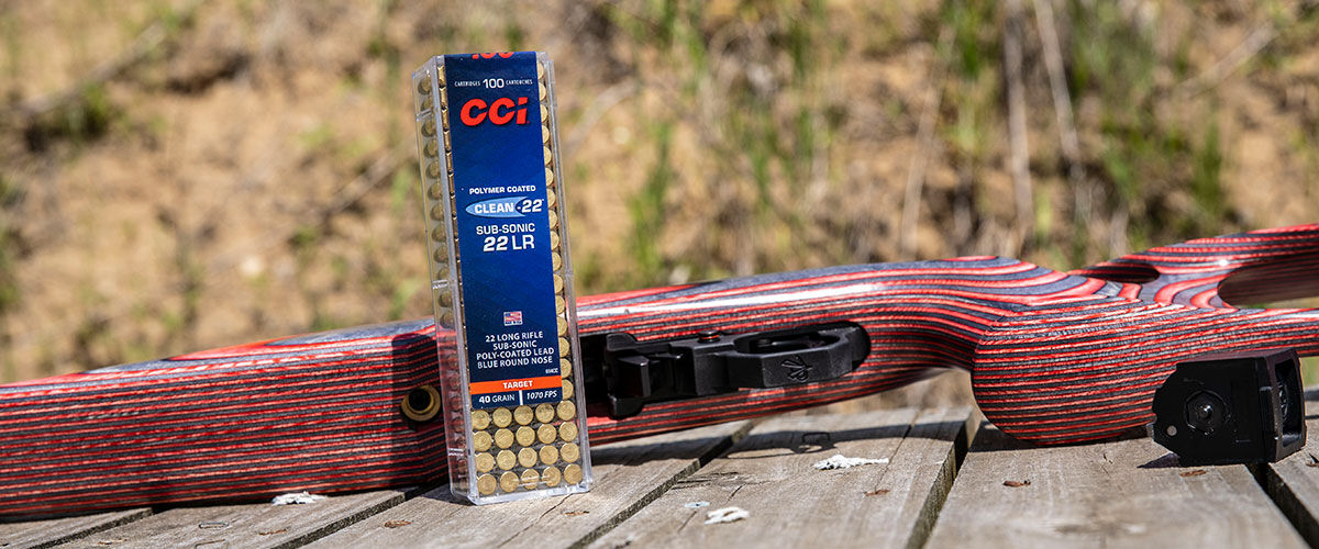 Clean-22 Sub-Sonic 22 LR ammo box next to a rifle on a table