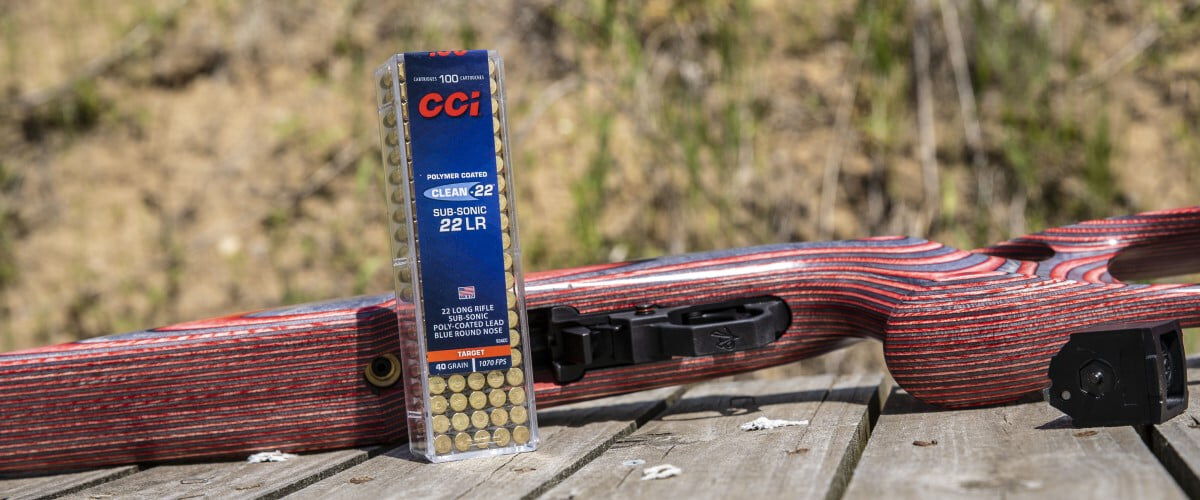 CCI Clean-22 Sub-Sonic 22LR box next to a rifle laying on a table
