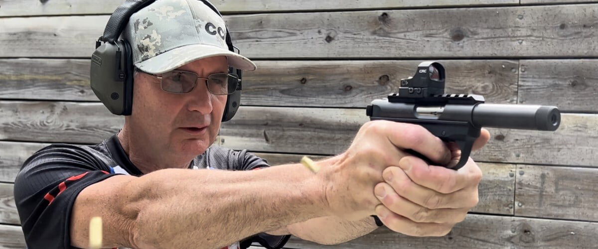 shooter looking down the sights of a pistol