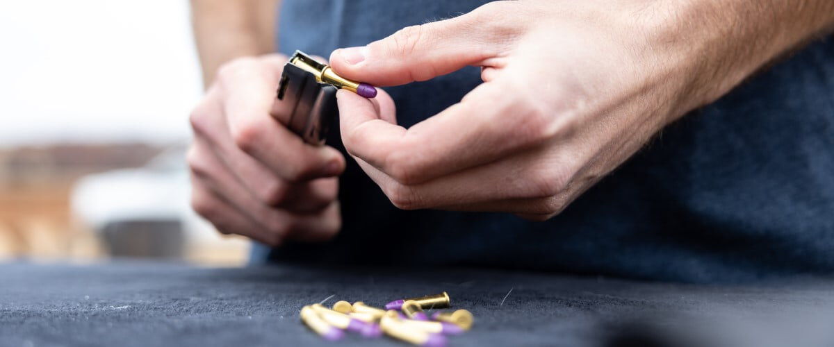 CCI ammunition being loaded into a magazine