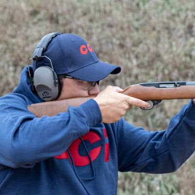 shooter looking down the iron sights of a rifle