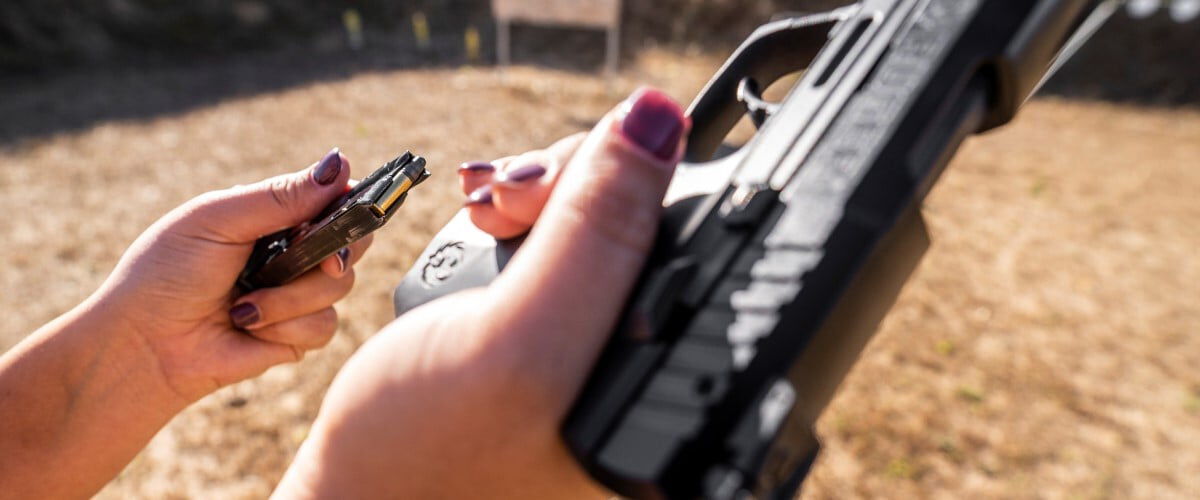 magazine being loaded into a handgun