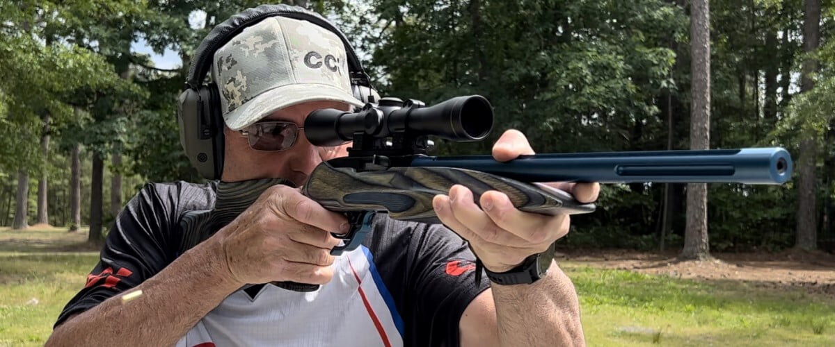 shooter looking down the scope of a rifle