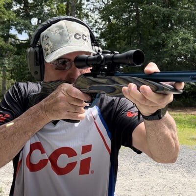 shooter looking down the scope of a rifle