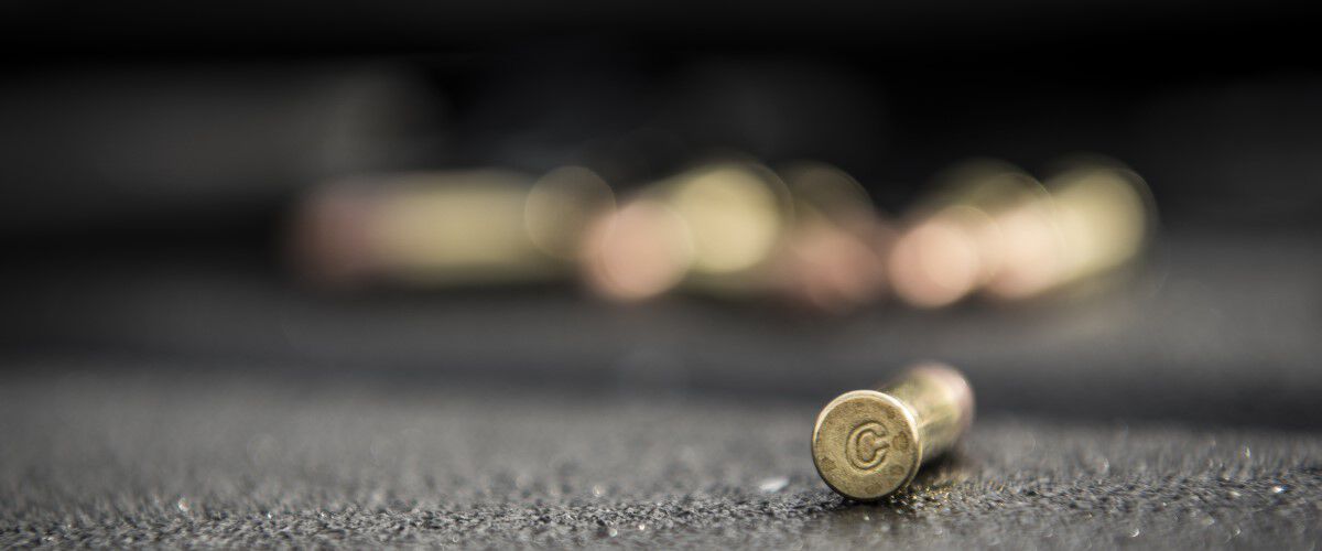 CCI cartridge laying on a table with other CCI cartridges behind it