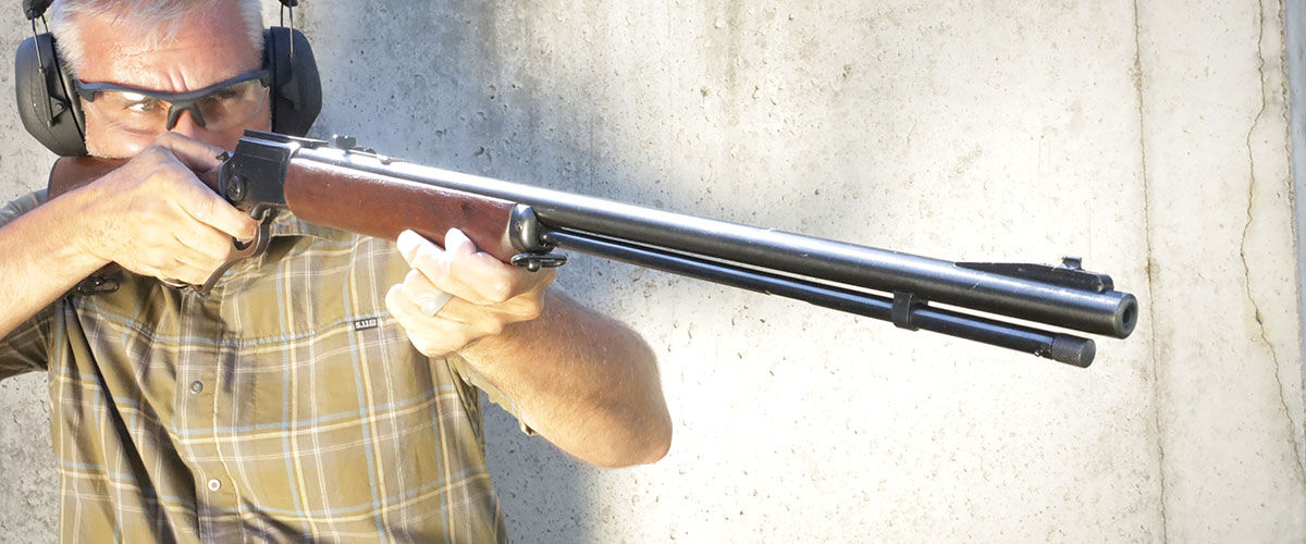 shooter aiming lever action rifle