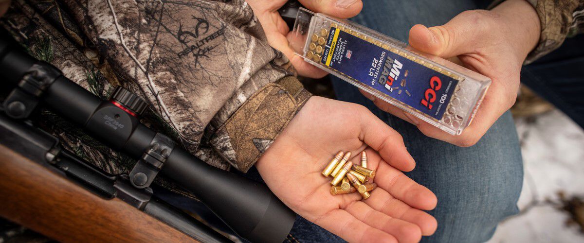 hunter holding MiniMag 22LR rounds in his hand