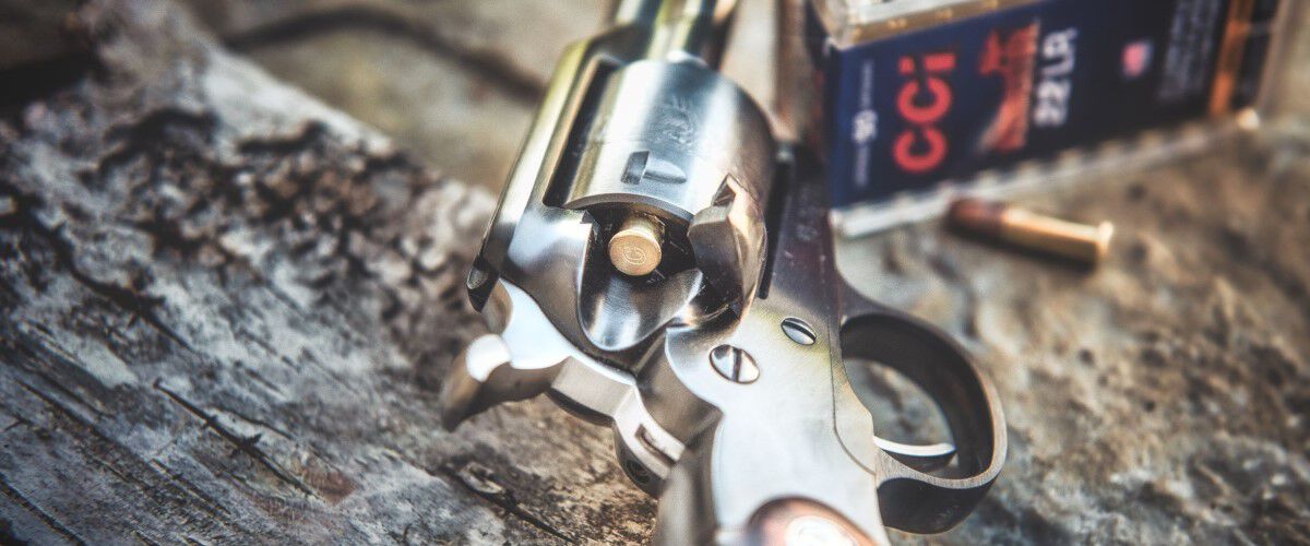 handgun with CCI ammo in the background