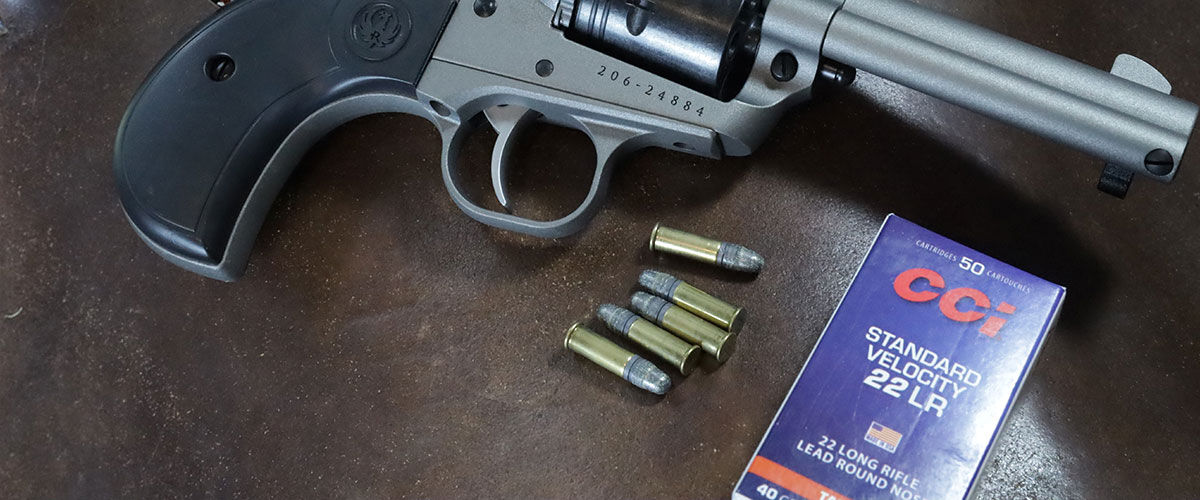 Standard Velocity 22LR box, cartridges, and revolver