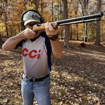 shooter looking down the iron sights of a rifle