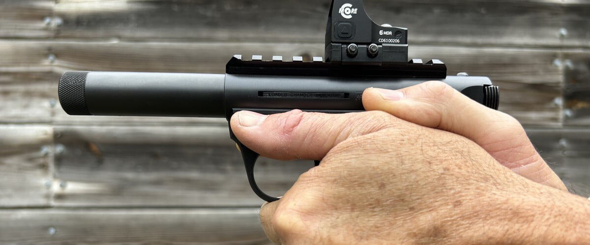 shooter holding a handgun with both hands
