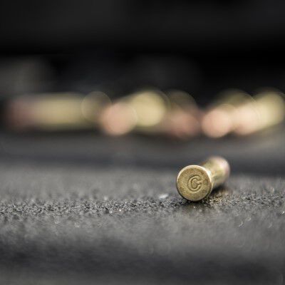 CCI cartridge laying on a table with other CCI cartridges behind it