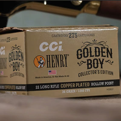 Golden Boy box in front of a Henry rifle
