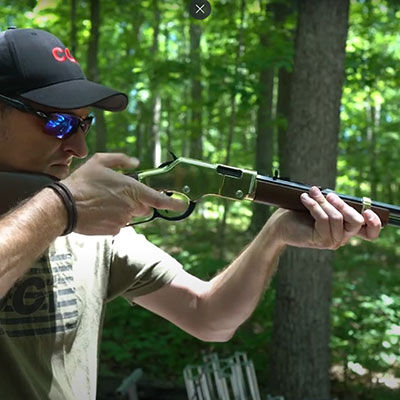 22plinkster aiming a lever action rifle