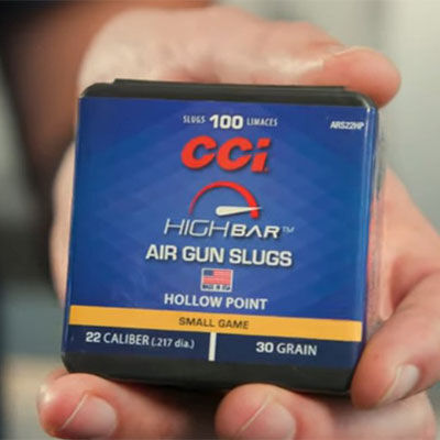 person holding a box of High Bar Air Gun