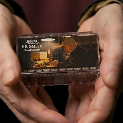 HB Smith holding a commerative box of ammo with this picture on it.